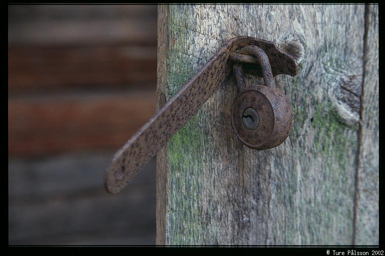 Old padlock in ruin