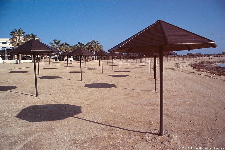 Parasols on deserted beach