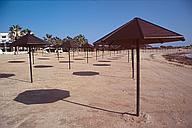 Parasols on deserted beach